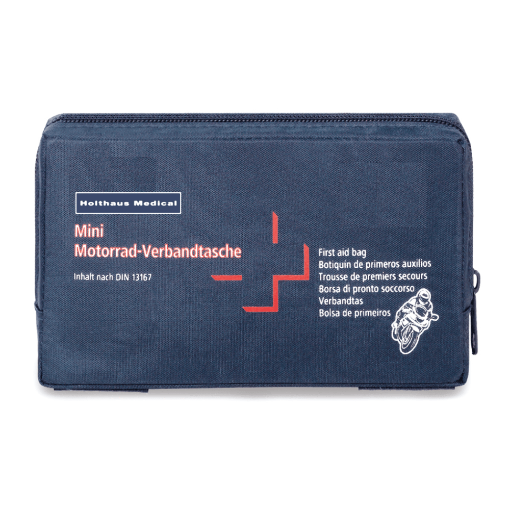 A dark blue first aid bag with the print “Holthaus Mini Motorcycle First Aid Kit DIN 13 16” in white and red lettering. The bag also features a small motorcycle illustration and contains multilingual labels indicating that it is a first aid kit according to DIN 13167, manufactured by Holthaus Medical GmbH & Co. KG.