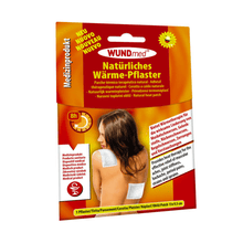 Packaging of Holthaus heat plaster, 9.5 x 13 cm - 1 piece from Holthaus Medical GmbH & Co. KG. The front shows a person using the plaster on their back and shoulder. The text highlights the 8-hour heat duration of the product and the benefits of heat therapy and is written in several languages. The packaging is predominantly red and white.