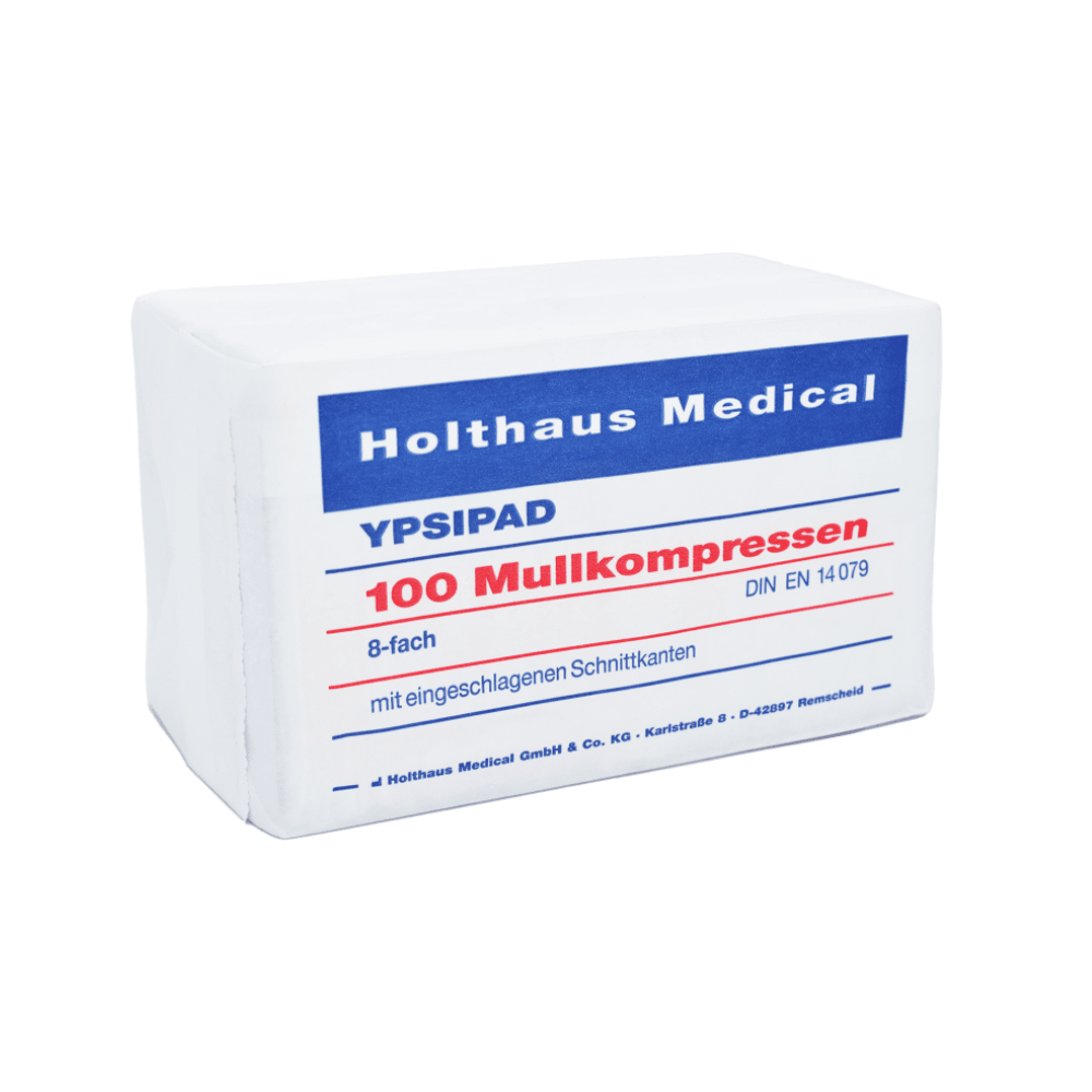 A rectangular package of Holthaus YPSIPAD gauze compress, 100 pieces, from Holthaus Medical GmbH & Co. KG, with German labeling indicating sterile gauze compresses for wound care. The packaging is white with blue and red text indicating size and standards.