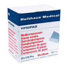 Displayed is a box of Holthaus YPSIPAD gauze compress from Holthaus Medical GmbH & Co. KG. The sterile packaging contains 25 packs, each with 2 gauze swabs measuring 10x10 cm. The text is printed in multiple languages, including German, English, Dutch, and Spanish.