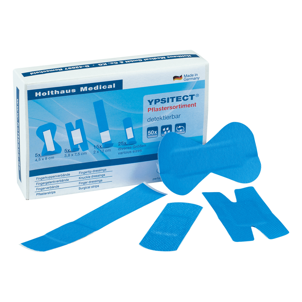 A collection of blue plasters in various shapes is displayed in front of an open box labeled „Holthaus YPSITECT® detectable plaster assortment – 50 plasters“ by Holthaus Medical GmbH & Co. KG, containing information in German. This assortment, ideal for the food processing industry, includes finger strips, knuckle bandages, and surgical strips.