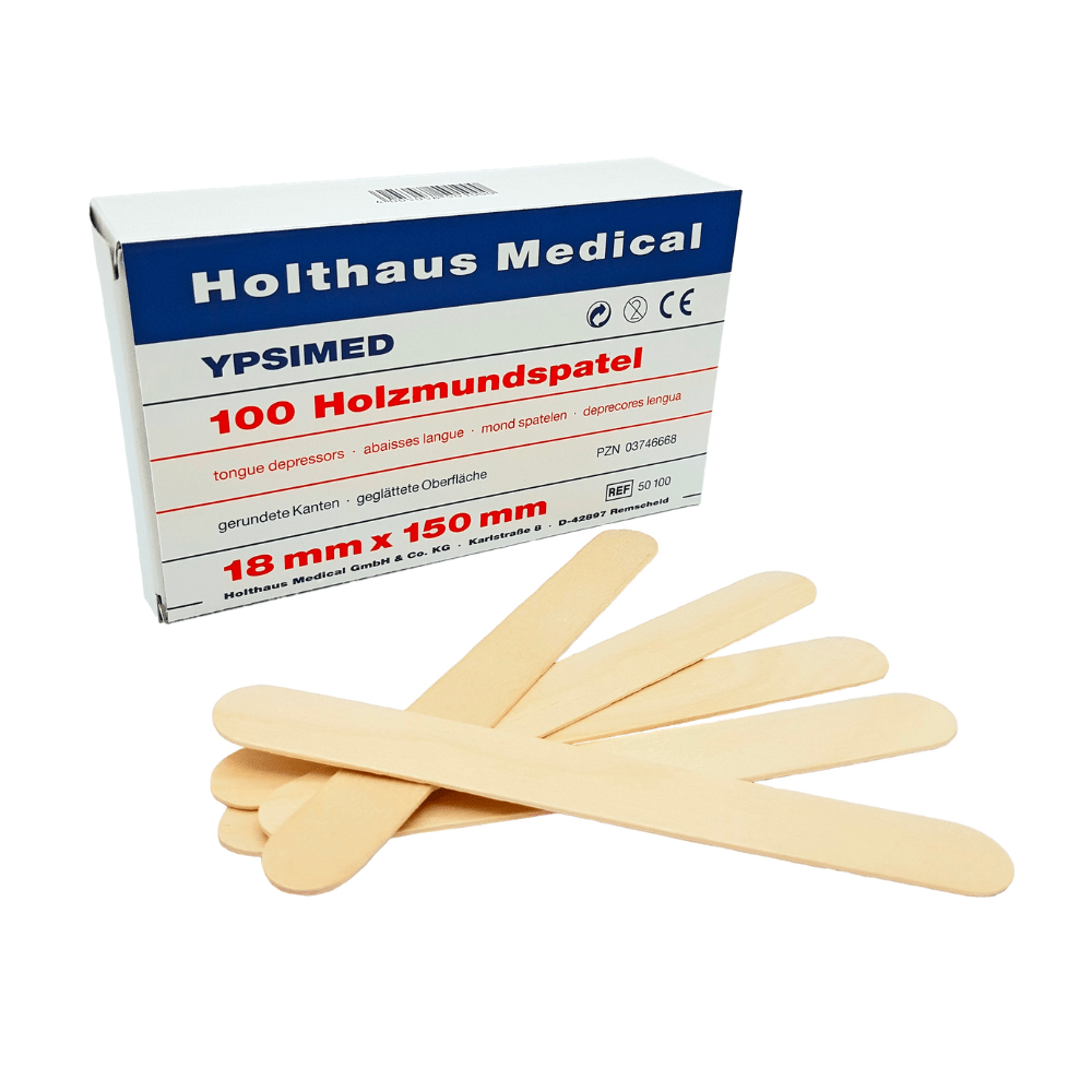 Pictured is a box labeled “Holthaus Ypsimed Wooden Tongue Depressors, 18 x 150 mm – 100 Pieces | Package (1 Piece)” from Holthaus Medical GmbH & Co. KG, ideal for medical use. Several wooden tongue depressors are spread out in front of the box. The white box with blue and red lettering indicates the dimensions 18 mm x 150 mm.