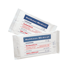 Pictured are two packs of Holthaus Ypsisave dressing wound pads from Holthaus Medical GmbH & Co. KG. The upper pack has a size of 400 x 600 mm, while the lower pack measures 600 x 800 mm. Both packs of the highly absorbent medical product are labeled with German text and medical labeling, perfect for first aid situations.