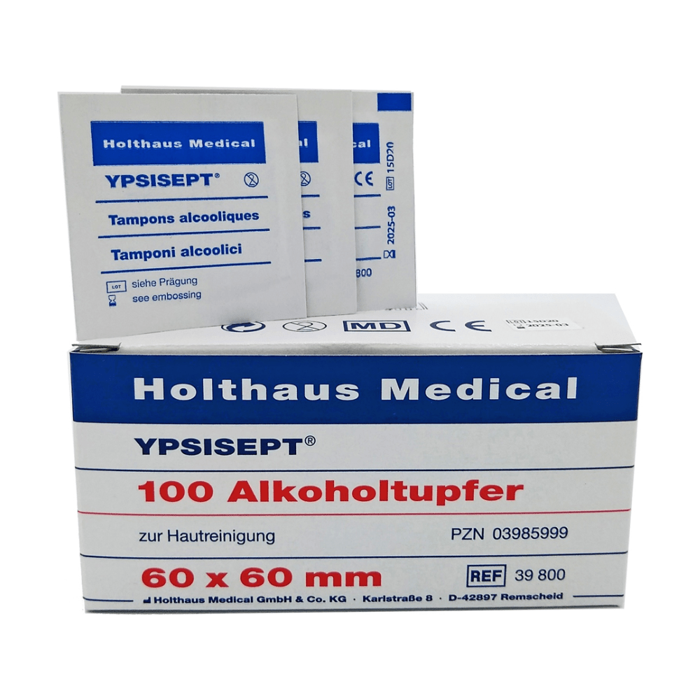 Image of a box from Holthaus Medical GmbH & Co. KG Holthaus Ypsisept® Alcohol Swabs 60 x 60 mm, 100 pieces | Package (1 piece). The box contains the text “100 alcohol swabs for skin cleansing” and “60 x 60 mm”. Behind the box are several individual isopropyl alcohol swab packets.