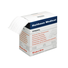 A box of Holthaus Ypsivil cellulose fleece compress 10 cm x 10 m from Holthaus Medical GmbH & Co. KG. The white box, marked with blue and red text, shows several cellulose fleece compress pads partially pulled out from the top.