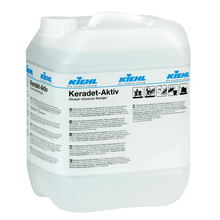 White 10-liter plastic container from Johannes Kiehl KG with the inscription "Kiehl Keradet-Active Alcohol Universal Cleaner", with printed instructions, safety symbols, a handle, and a screw cap. Suitable for all surfaces.