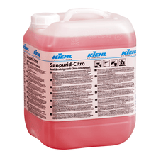 A large transparent plastic container with a white lid contains a red liquid. The label reads "Kiehl Sanpurid-Citro sanitary cleaner with citrus fresh scent" by Johannes Kiehl KG and contains information and instructions in German.