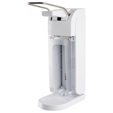 The Johannes Kiehl KG ManoDos-standard soap and disinfectant dispenser (500 ml/1 L) made of plastic with a long operating lever, transparent closure cover, and drip tray for KIEHL rectangular bottles is shown against a white background.