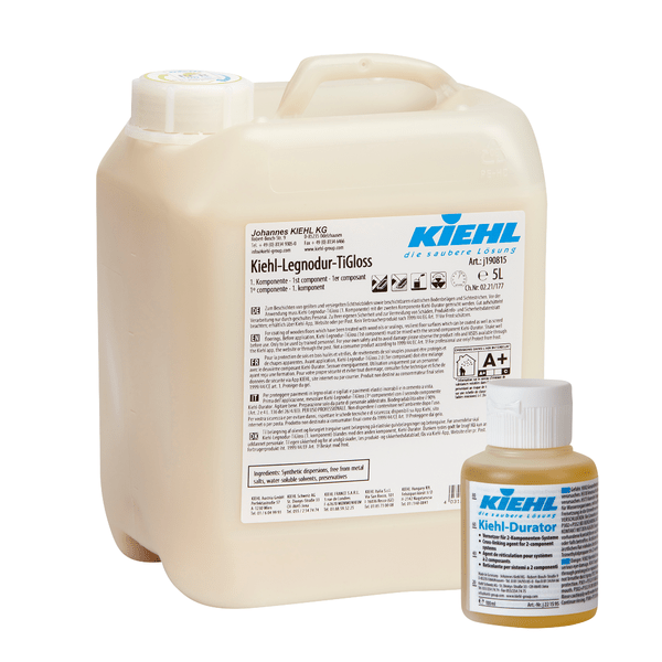 A 5L Johannes Kiehl KG Kiehl-Legnodur-TiGloss stands behind a 100ml Kiehl-Durator bottle, both with detailed labels for their self-glossing 2-component permanent coating for surface protection.