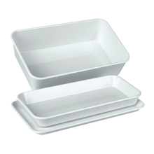 A set of three stacked white rectangular instrument trays from Servoprax GmbH, consisting of an upper tray with higher edges (190 x 150 x 40 mm) and two shallower trays with a flat bottom. Ideal for organizing your important utensils in a sleek, heat-resistant design.