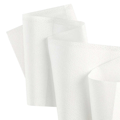 Two folded white Kimtech® Wettask™ DS Wipes from Kimberly-Clark GmbH in front of a plain background show their dotted texture and versatility; pictured here as small rolls (12 x 55 sheets) in a box.