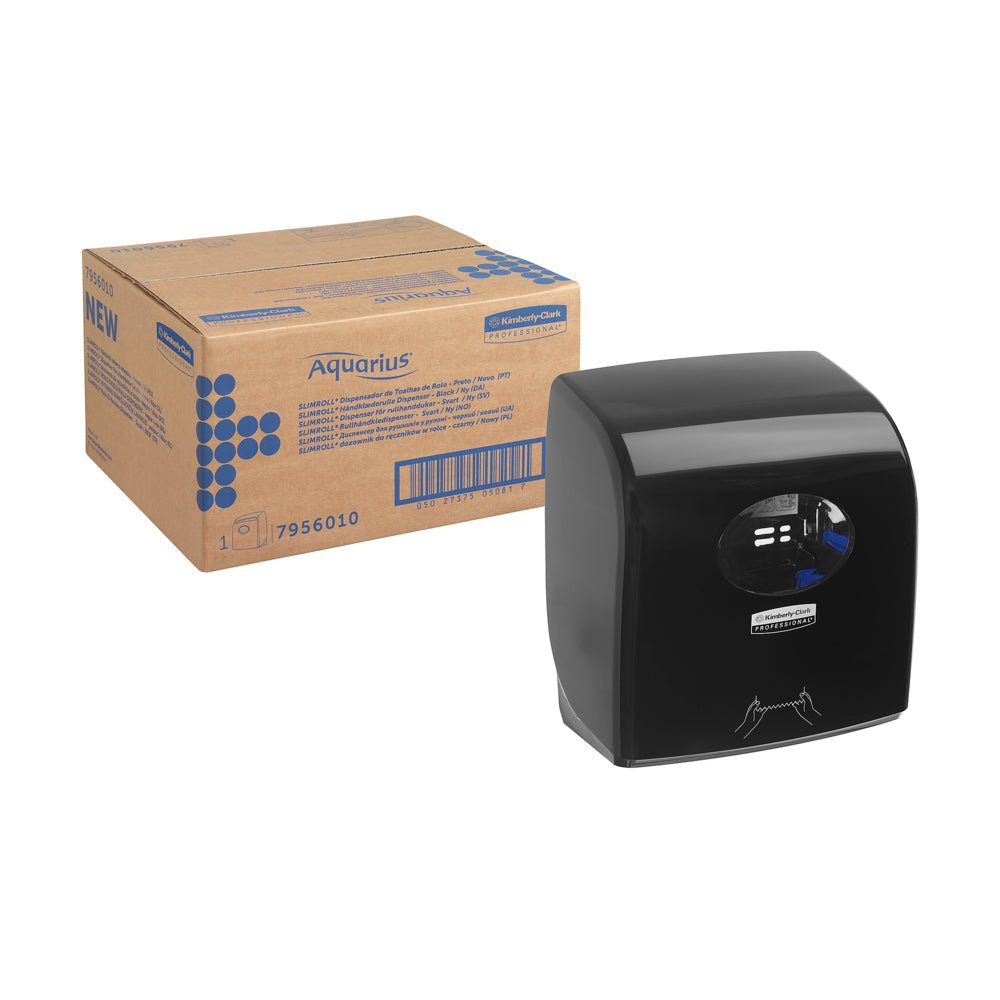 Nearby is a carton labeled "Aquarius™ Slimroll™ roll towel dispenser - Black" from Kimberly-Clark GmbH, equipped with a transparent window and a hand symbol for hygienic towel dispensing.