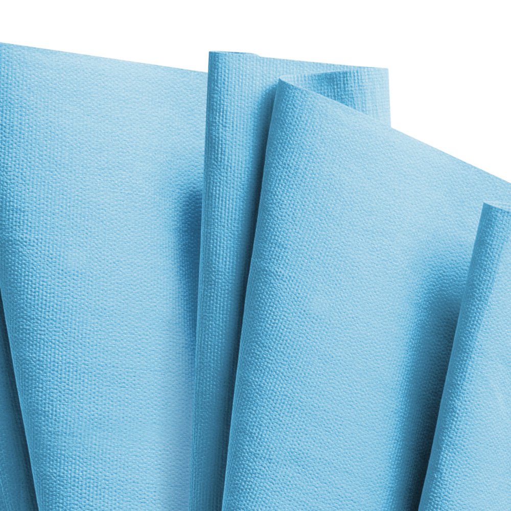 Several WypAll® X80 PowerClean cleaning cloths in steel blue from Kimberly-Clark GmbH are fan-shaped and display their textured surface.