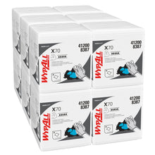Six stacked packages of WypAll® X70 PowerClean cleaning cloths (quarter-folded, white, 12 bags x 76 cloths) from Kimberly-Clark GmbH with product name, number 412008387, and a hand illustration during use.