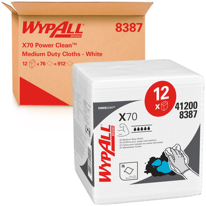 A box labeled "Kimberly-Clark GmbH WypAll® X70 PowerClean - Quarter-Folded / White" contains 12 bags with 76 sheets of white, folded industrial cleaning cloths with product details and usage symbols on the packaging.