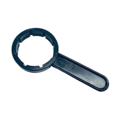 A Dr. Schnell canister key from DR.SCHNELL GmbH & Co. KGaA in black plastic design with a round slot and straight handle is depicted on a white background.