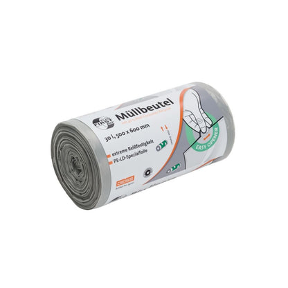 A roll of gray garbage bags from EMIL DEISS KG (GmbH + Co.), labeled as DEISS First Plus Pcr garbage bag 30 liters, 34041, with the dimensions '1500x600 mm'. The packaging shows a hand pulling out a bag and emphasizes the 40% post-consumer recycled content and climate-neutral production.