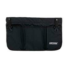 The Arcora Multi Tool Belt Hip Work Bag With Belt Black from Arcora International GmbH is a black fabric bag with three front pockets, two adjustable top buckle straps, and the print "ARCORA" in white at the bottom right.
