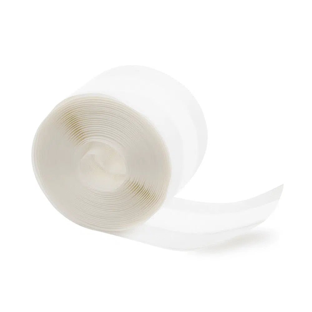 A roll of Meditrade ABE® Light elastic wound bandage, partially unrolled, isolated on a plain white background. The band appears translucent and lightly textured, suitable for use as an elastic wound bandage.