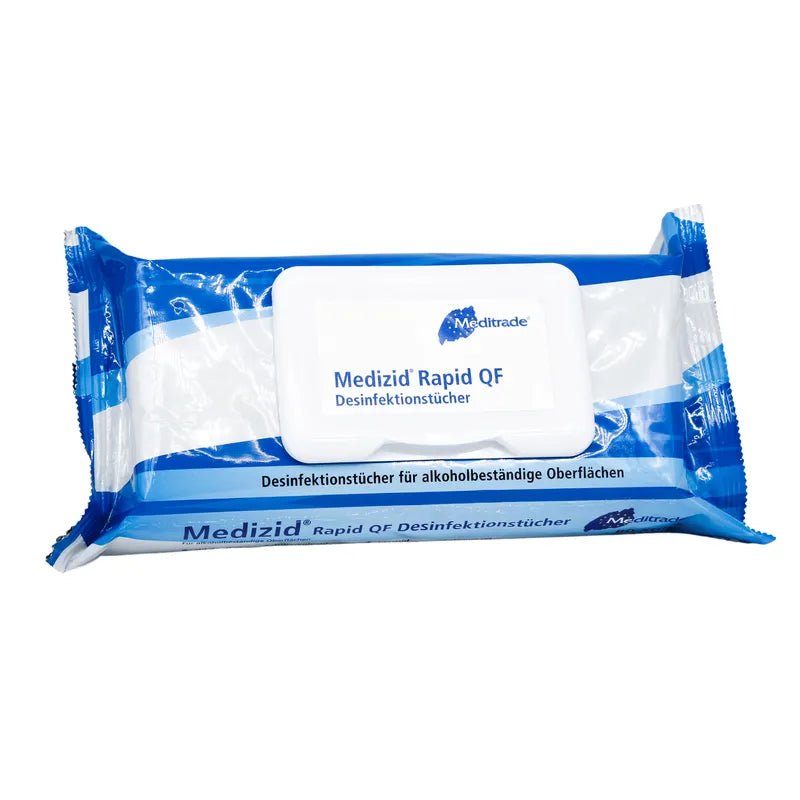 A packaged Meditrade Medizid® Rapid QF Flowpack disinfectant wipe for alcohol-resistant surfaces, depicted against a white background. The packaging is blue and white with German text.