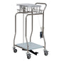 A stainless steel medical cart with four wheels, wire basket, flat shelf, lower shelf, handles, foot pedal, dispenser for disposable gloves, and a Novocal collector for foil tubing made of stainless steel attached to one side (1 piece).