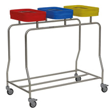 The Novocal Triple Stainless Steel Laundry Collector "Compact" offers efficient laundry sorting thanks to three colored lids (red, blue, yellow). Four wheels enable mobility; the open frame design saves space and impresses with functionality.
