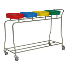 The Novocal stainless steel laundry collector "Kompakt plus" is a four-compartment collector with color-coded containers in red, blue, yellow, and green. Thanks to wheels and a handle, it is easy to transport.