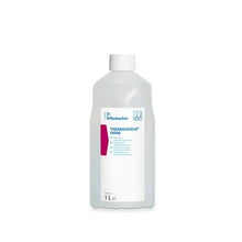 A transparent 1-liter plastic bottle from Dr. Schumacher GmbH with a white cap and the label "Dr. Schumacher THERMOSHIELD SHINE | Bottle (1 l)" stands upright against a white background.