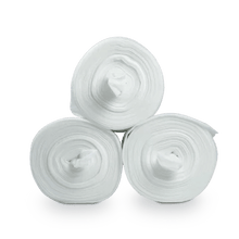Three Dr. Schumacher DESCO WIPES non-woven cloth rolls from Dr. Schumacher GmbH are stacked in a triangle on a light background. From the side view, the rolls display their circular, concentric pattern, ideal for use in non-woven cloth dispensing systems.