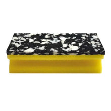 The Arcora PU-PAD SPONGE (150 x 70 x 45 mm) from Arcora International GmbH has a yellow PU foam base and a black and white marbled scrubbing surface; available in packs of 10, depicted on a white background.