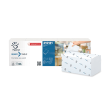 A hand pulls a napkin from the Papernet ¼ fold napkin packaging of Sofidel Germany GmbH, proudly displaying the FSC-certified label. The packaging, adorned with a blue logo pattern, presents important details such as the article code 416181, embodying the excellence of the Ready Table technology.