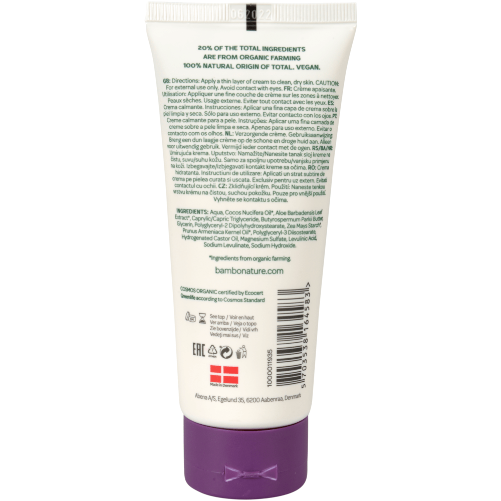 On a white plastic tube with a purple cap, green text with instructions, precautions, ingredients, certifications, and contact information is printed. In the middle of the label, it says "bamfordnature.com". The Bambo Nature care cream from Abena Re-Seller GmbH is color and fragrance-free.