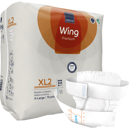 Pictured is a pack of ABENA Wing Premium adult diapers by Abena Re-Seller GmbH with an unfolded XL2 diaper in the foreground. The pack contains 15 incontinence products in X-Large with belt, offering protection and comfort.