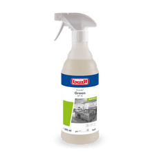 A 600 ml spray bottle of Drizzle® Green oil and grease remover colorless - light yellow by BUZIL-WERK Wagner GmbH & Co. KG, with a gray spray nozzle and a label with a kitchen image, product name, and application instructions.