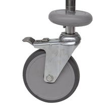A gray steering wheel with Novocal shock discs (1 set = 4 pieces, 1 piece per package), metal bracket, and foot brake, attached to a metal rod - perfect as a sorting shelf trolley replacement from Novocal.