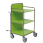 A Novocal station trolley made of stainless steel with fully welded round tube connections is shown empty on a white background. It features three shelves, metal rails, and four wheels - one of which has a brake lever.