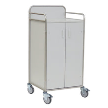 The Novocal station cart features a stainless steel frame with fully welded round tube connections, two cabinet doors, four gray casters, and metal railings, ideal for mobile storage and transport in hospitals or care facilities.