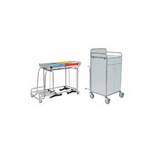 A Novocal stainless steel station wagon with welded pipe connections stands next to a white, mobile medical cabinet-practical for clinics or hospitals.
