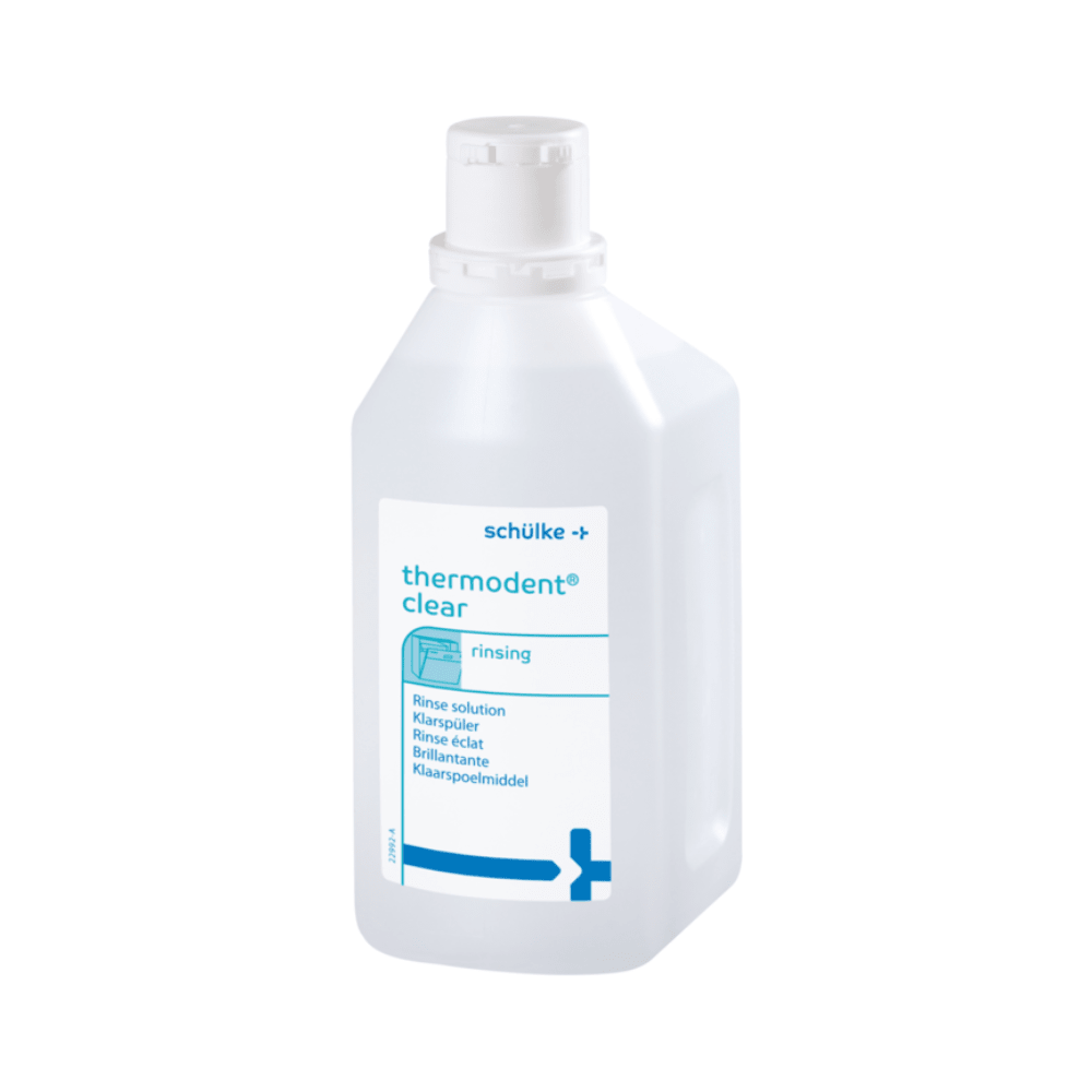 On a blue-white plastic bottle with the inscription "Schülke Thermosept BSK- 1 Liter," the lettering "Rinse Aid" for dental hygiene is highlighted. The label of Schülke & Mayr GmbH indicates its suitability for dental instruments and features a secure screw cap.