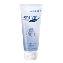 The Schülke sensiva® Protective Cream Skin Protection is available in a white tube with blue branding, highlighting its water-in-oil formula. It is free from dyes and perfumes and features an image of hands on the front to emphasize protection against skin irritations.