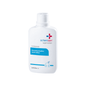 A white plastic bottle of Schülke Octenisan Wash Lotion from Schülke & Mayr GmbH with a flip cap. The blue-accented label describes the antiseptic skin cleansing solution for medical facilities.