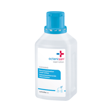 A clear plastic bottle of Schülke Octenisan Wash Lotion from Schülke & Mayr GmbH with a blue cap and bilingual label stands upright on a white background, ideal for antiseptic skin cleansing and hygienic body care.