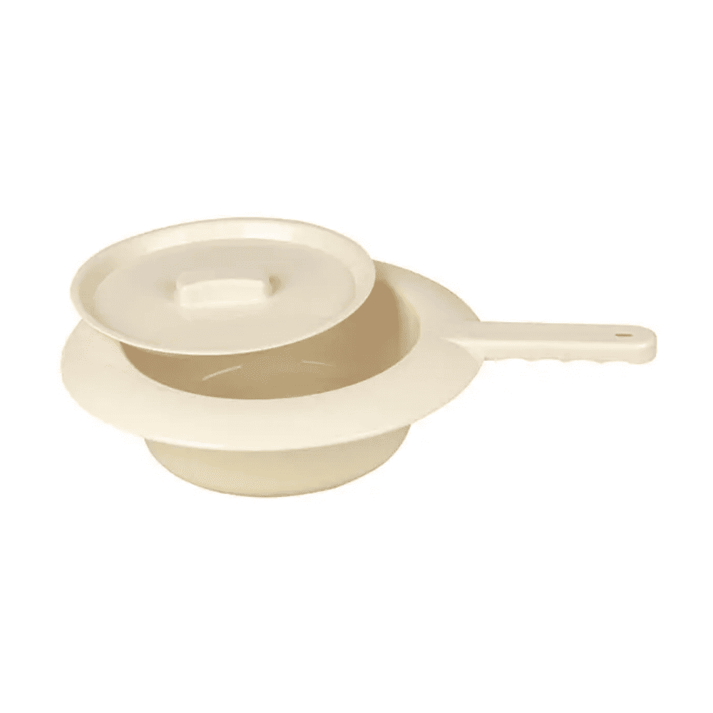 Against a white background, the Servoprax plastic bedpan - 300 x 80 mm from Servoprax GmbH is depicted. It consists of a beige polypropylene structure with a lid and handle. The lid is slightly open, offering a view into the interior of the bedpan, highlighting its simple and functional design.