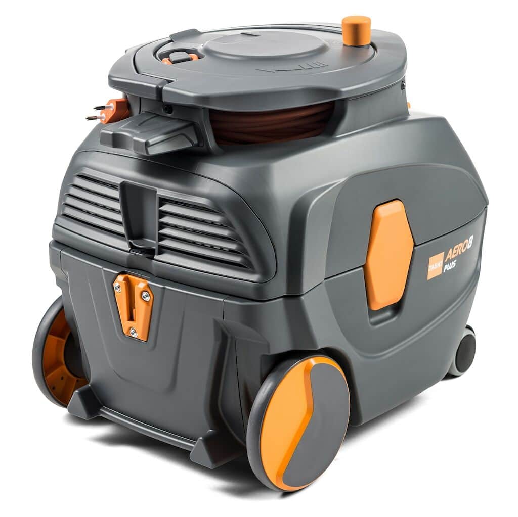 The TASKI AERO 8 PLUS from Diversey Deutschland GmbH & Co. OHG is a compact, powerful, and quiet floor vacuum cleaner in gray and orange. It features large wheels for easy mobility, a convenient top handle, and various locks and compartments for excellent storage and functionality. Thanks to its whisper technology, it operates quietly without compromising performance.
