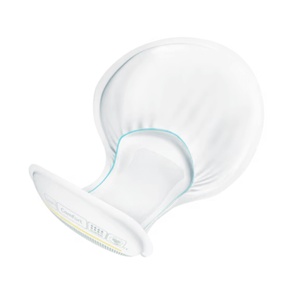 A TENA Comfort Maxi incontinence pad, featuring a white, curved shield with a wide, round flange and a narrower, textured stem, offers impressive absorbency. Its ergonomic design ensures comfort during use and enhances the overall experience.
