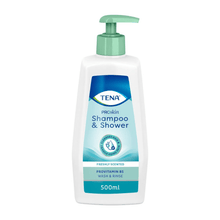 The TENA Shampoo & Shower 500 ml from Essity Germany GmbH with a green pump closure is ideal for sensitive skin. Its fresh-smelling formula enriched with provitamin B5 is presented in an elegant white packaging with blue and green accents.