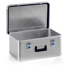 A rectangular Novocal aluminum transport box with a hinged lid, black handle, and two blue locks. The open lid reveals an empty interior. The exterior has a textured surface. Contains one stackable unit per pack.