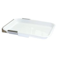 A white rectangular Novocal drip tray including a holder. Wall-mounted holder for disinfection station, with raised edges and two metal clips, ideal for hygienic storage, photographed against a white background.