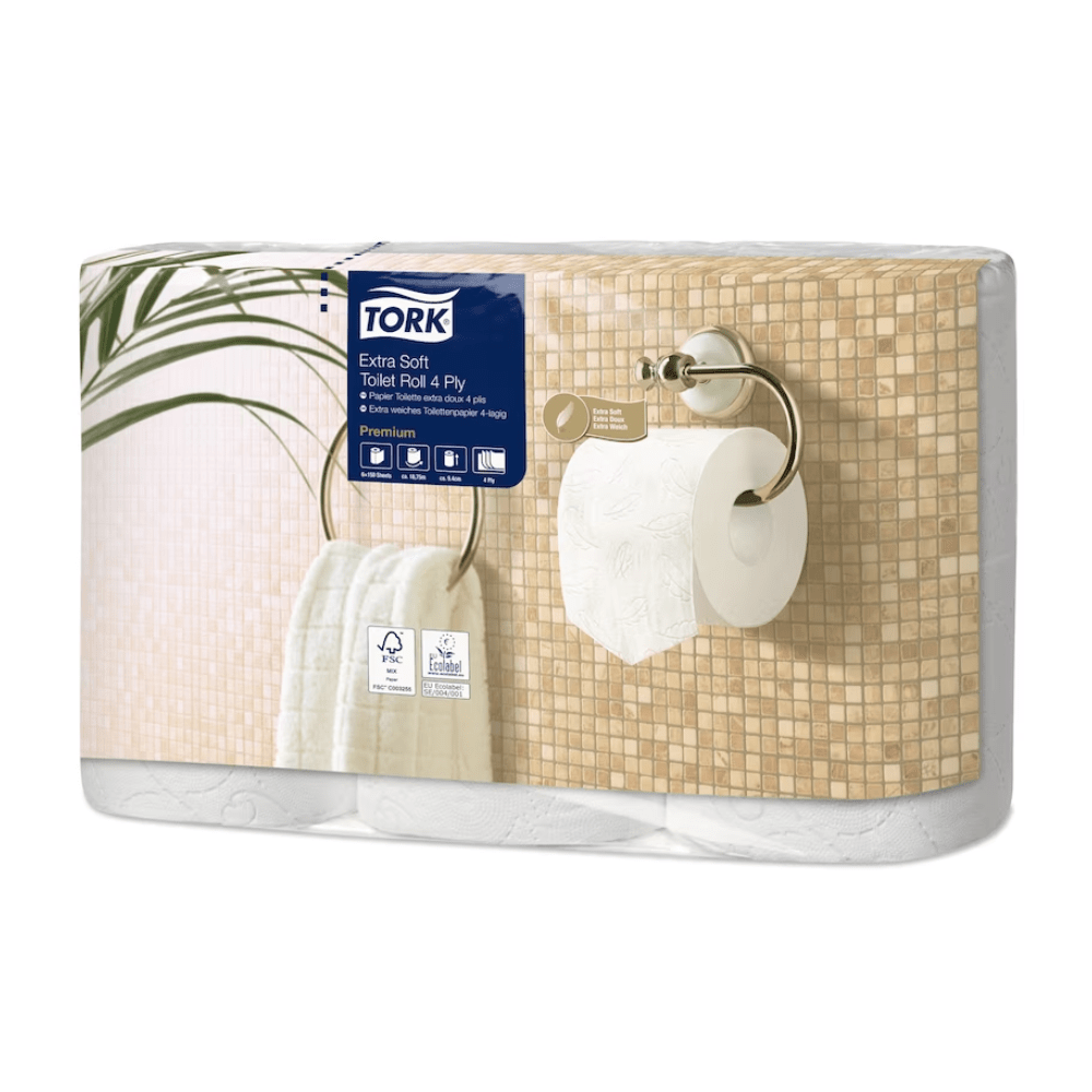 The image shows a pack of Tork 110406 extra soft small roll toilet paper Premium T4 4-ply, presented by TORK – Essity Professional Hygiene Germany GmbH. The packaging shows a marble-tiled wall with a mounted holder and a white towel on a ring, ideal for upscale washrooms. This product is referred to as Premium toilet paper.