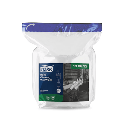 A pack of Tork 190692 Moist Hand Cleaning Wipes Refill Premium W14 1-ply is displayed. The transparent packaging features a blue-white label from TORK – Essity Professional Hygiene Germany GmbH, highlighting the premium cleaning instructions and brand identity. It is sealed at the top and contains 58 wipes that effectively remove oil and dirt.